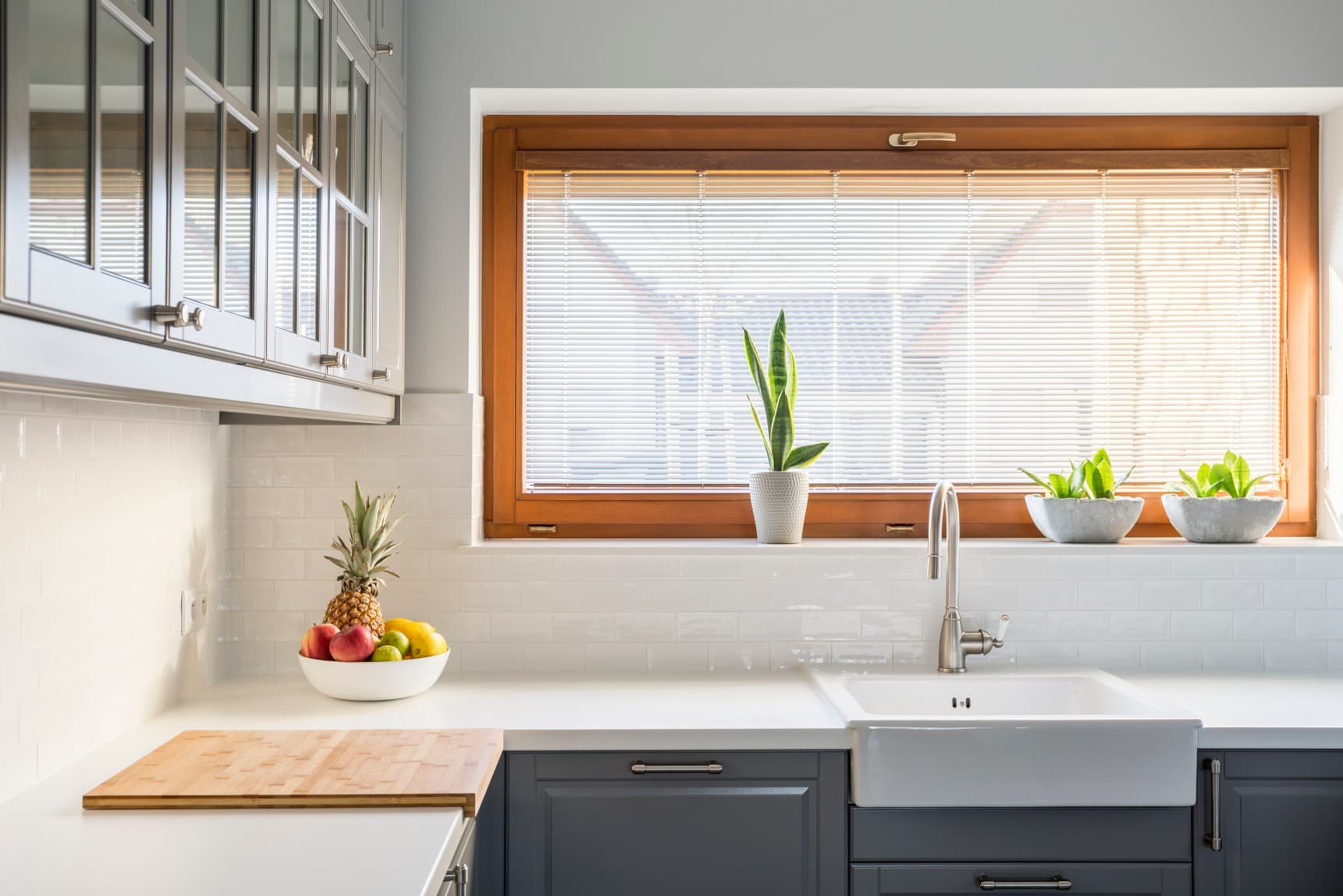 Bright living room with custom roller shades filtering soft daylight